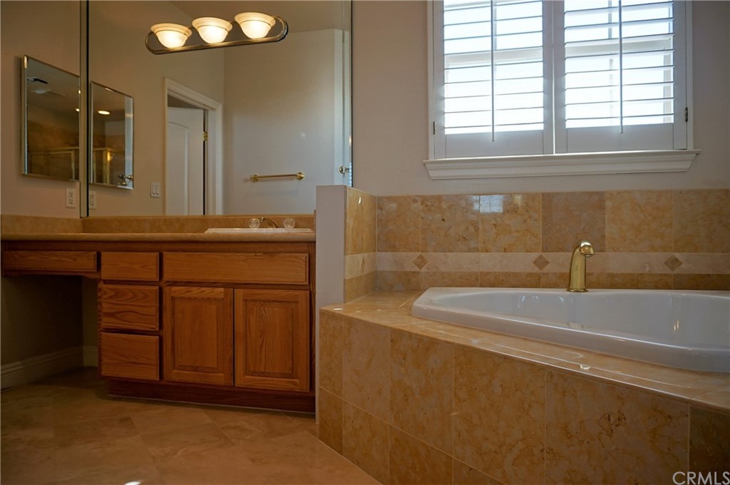 705 Cortez Road Arcadia, CA 91007 - Photo 27 of 70 a bathroom with a tub sink and mirror