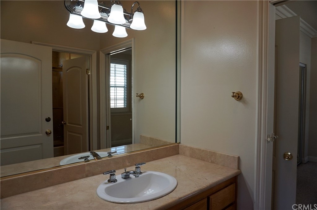 705 Cortez Road Arcadia, CA 91007 - Photo 30 of 70 a bathroom with a sink and a mirror
