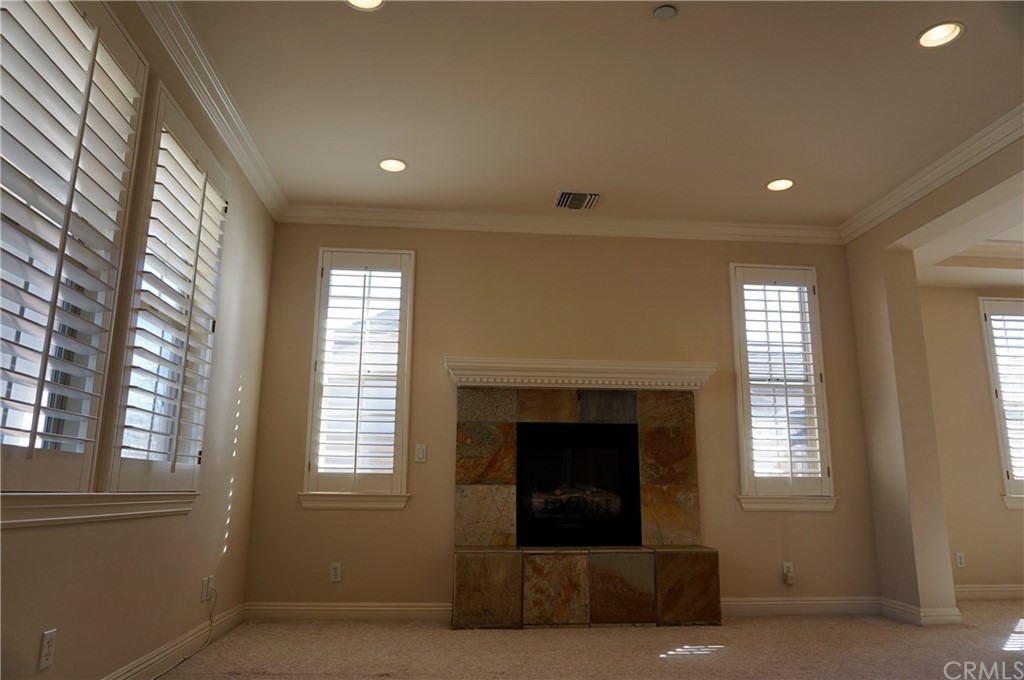 705 Cortez Road Arcadia, CA 91007 - Photo 38 of 70 a living room with furniture and a fireplace