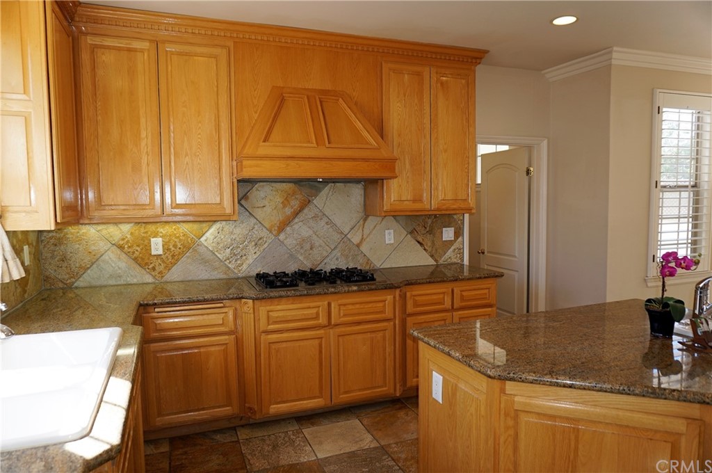 705 Cortez Road Arcadia, CA 91007 - Photo 42 of 70 a kitchen with a sink and cabinets