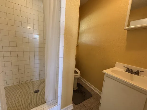 a bathroom with a sink and a shower