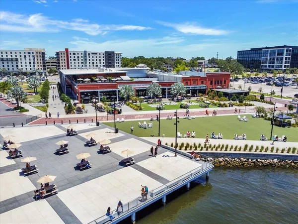 a view of a city with lawn chairs and a fountain