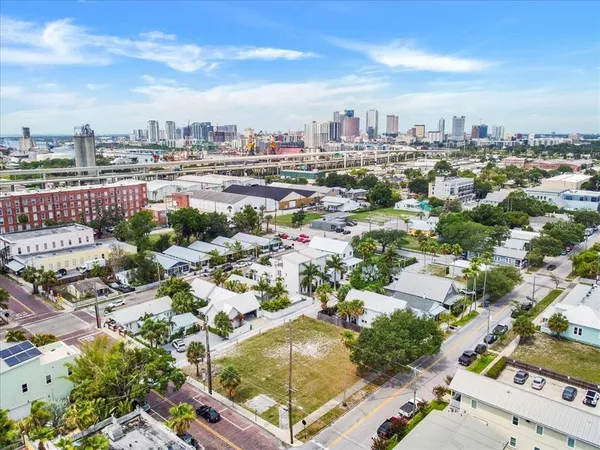 an aerial view of a house with a yard