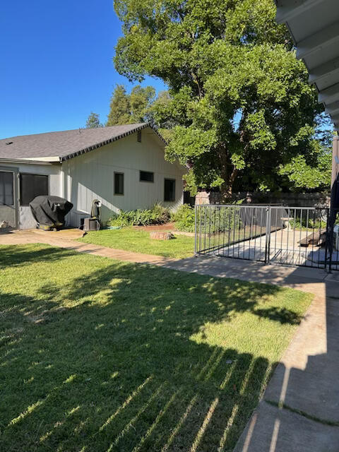 2046 Silverfield Loop Redding, CA 96002 - Photo 2 of 17 a view of a house with pool and sitting area