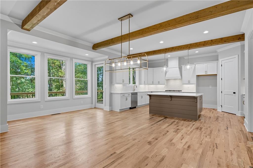 116 Dallas Mark Drive Canton, GA 30115 - Photo 11 of 43 a large kitchen with stainless steel appliances kitchen island a large counter top and a wooden floors