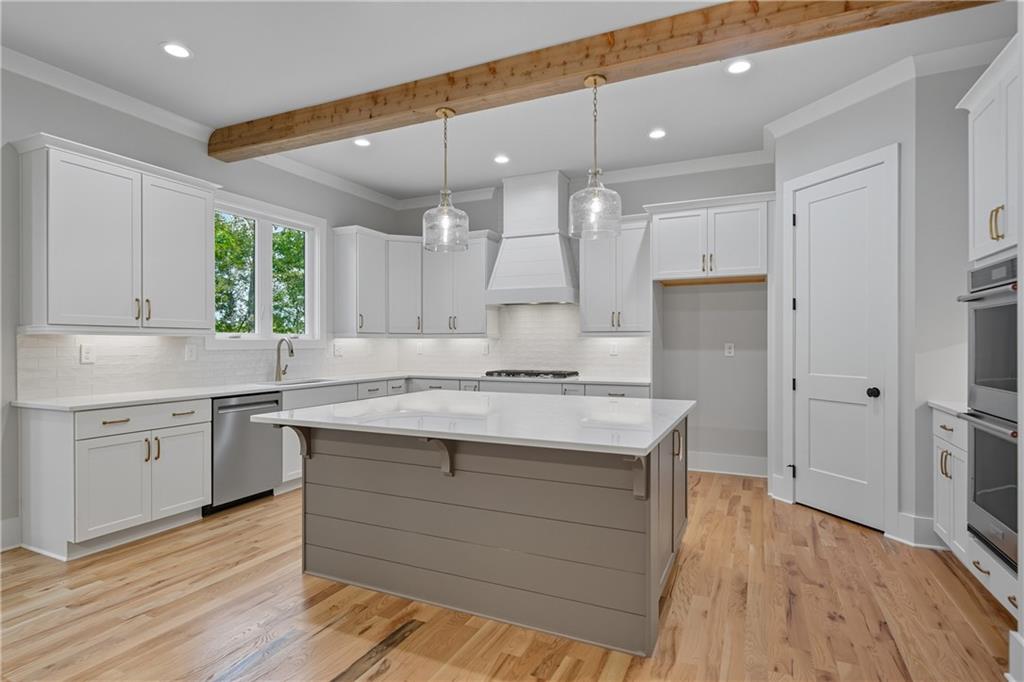 116 Dallas Mark Drive Canton, GA 30115 - Photo 15 of 43 a kitchen with a sink window and cabinets