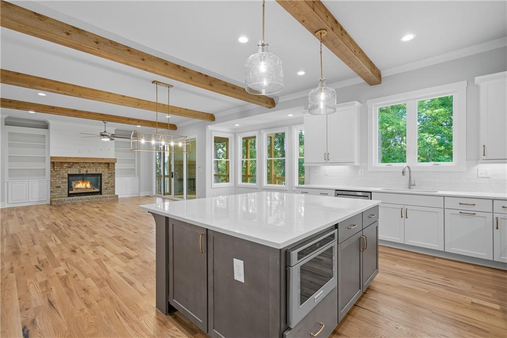 116 Dallas Mark Drive Canton, GA 30115 - Photo 19 of 43 a kitchen with a stove and a sink