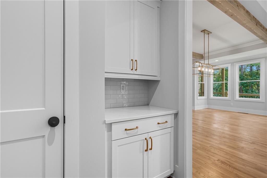 116 Dallas Mark Drive Canton, GA 30115 - Photo 21 of 43 a view of a kitchen with white wooden cabinets