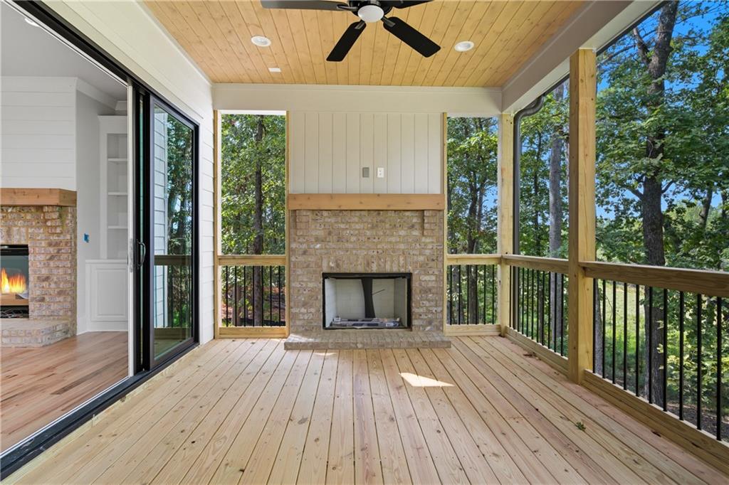 116 Dallas Mark Drive Canton, GA 30115 - Photo 25 of 43 a view of empty room with wooden floor and fireplace