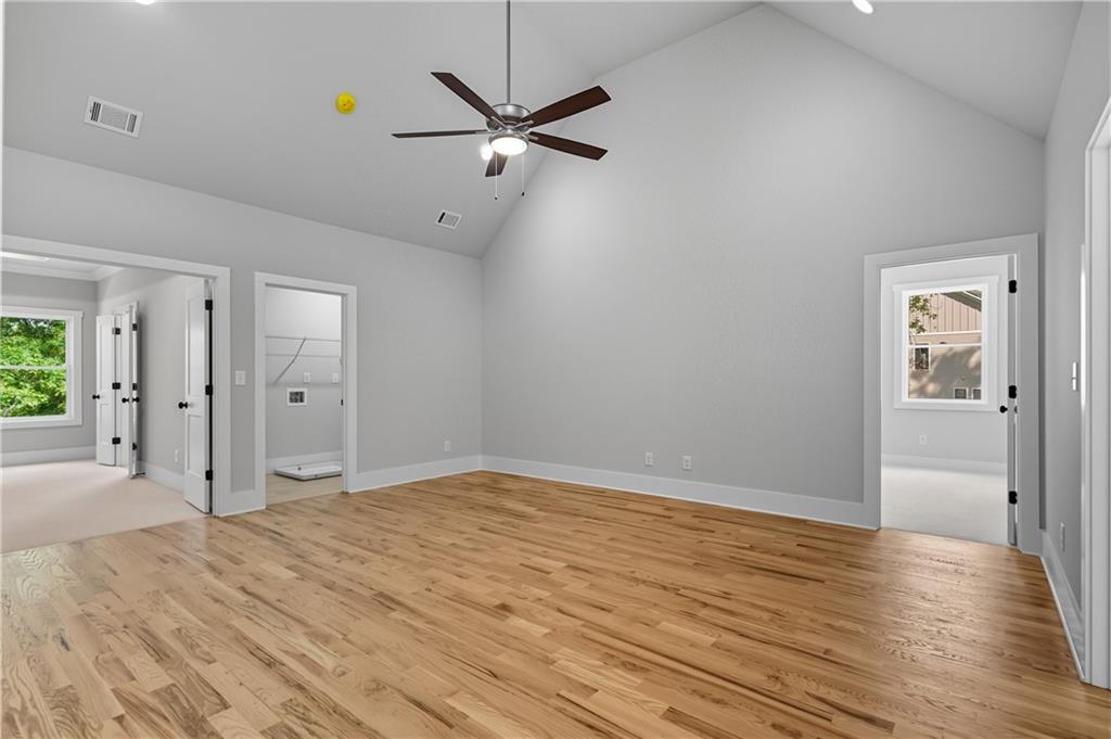 116 Dallas Mark Drive Canton, GA 30115 - Photo 26 of 43 a view of a room with wooden floor and a ceiling fan