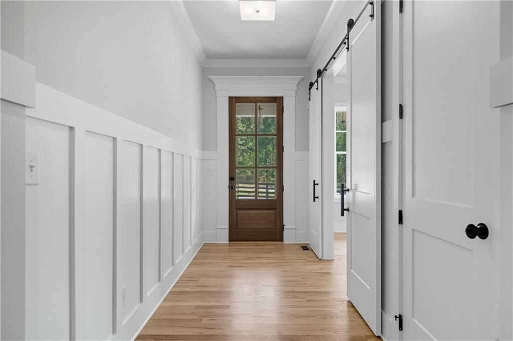 116 Dallas Mark Drive Canton, GA 30115 - Photo 3 of 43 a view of a hallway with wooden floor and closet area