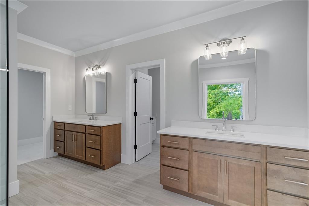 116 Dallas Mark Drive Canton, GA 30115 - Photo 32 of 43 a spacious bathroom with a double vanity sink and a mirror