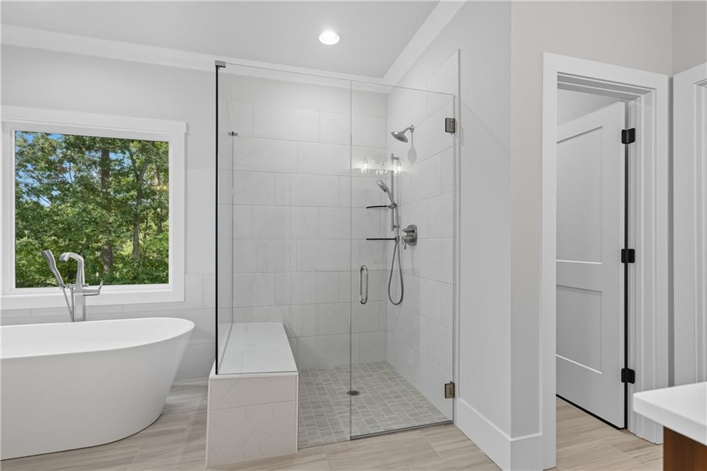 116 Dallas Mark Drive Canton, GA 30115 - Photo 34 of 43 a bathroom with a bathtub and shower