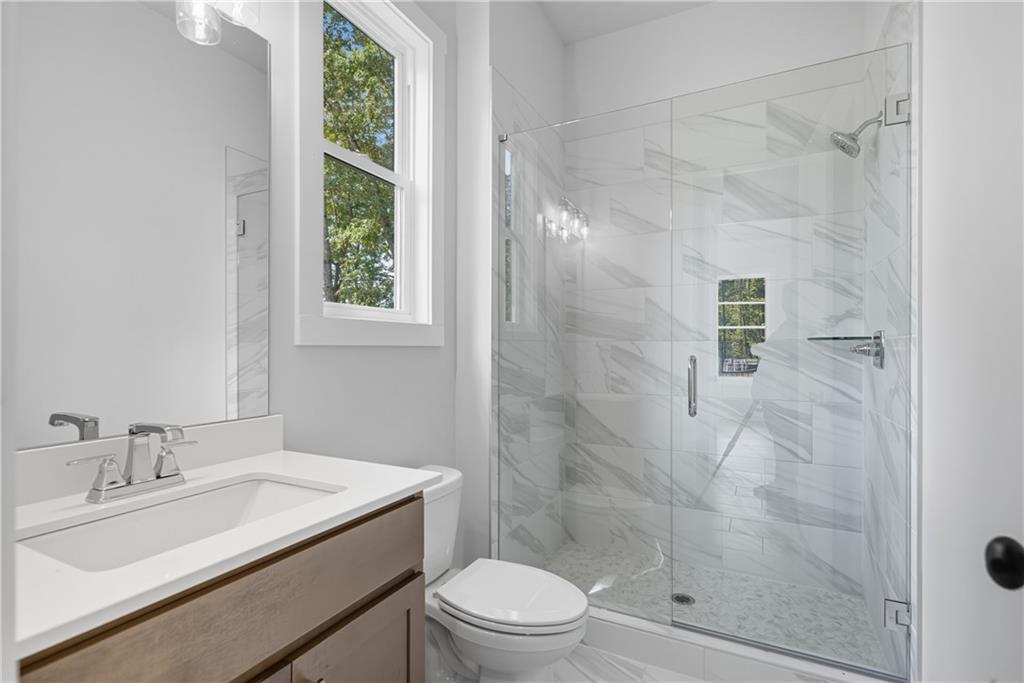 116 Dallas Mark Drive Canton, GA 30115 - Photo 5 of 43 a bathroom with a sink toilet and shower