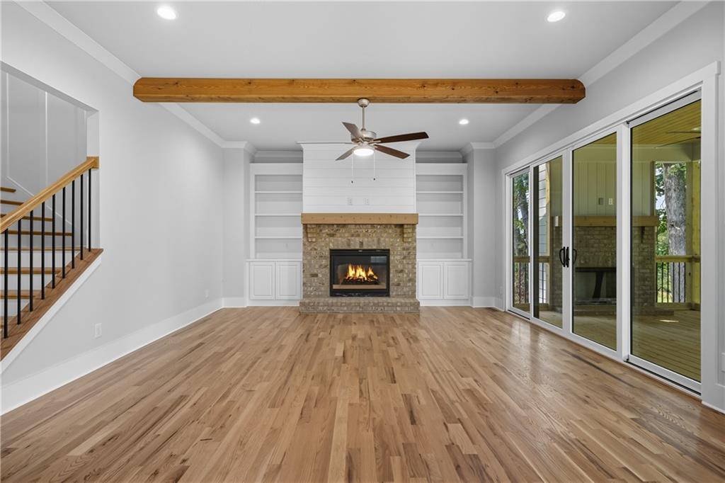 116 Dallas Mark Drive Canton, GA 30115 - Photo 6 of 43 a view of an empty room with a fireplace and a window