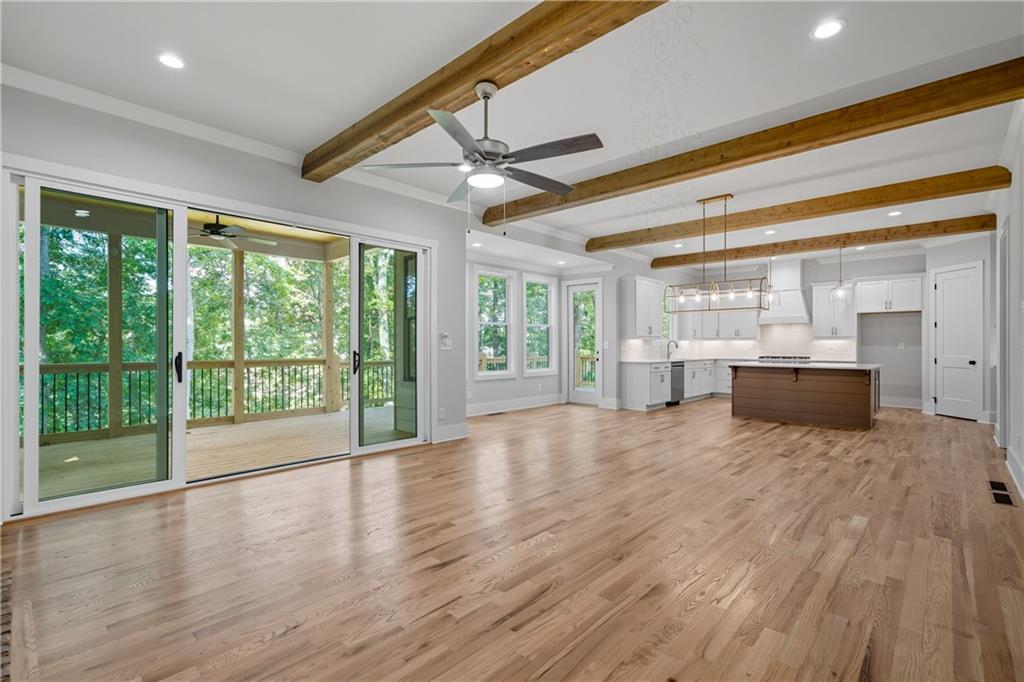 116 Dallas Mark Drive Canton, GA 30115 - Photo 9 of 43 a big room with wooden floor and windows
