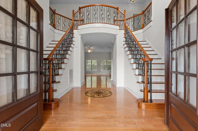 a view of entryway and hall with wooden floor