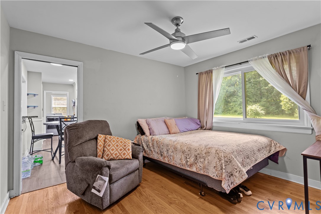 7586 Willson Road Henrico, VA 23231 - Photo 15 of 32 Bedroom with light wood-type flooring and a ceilin