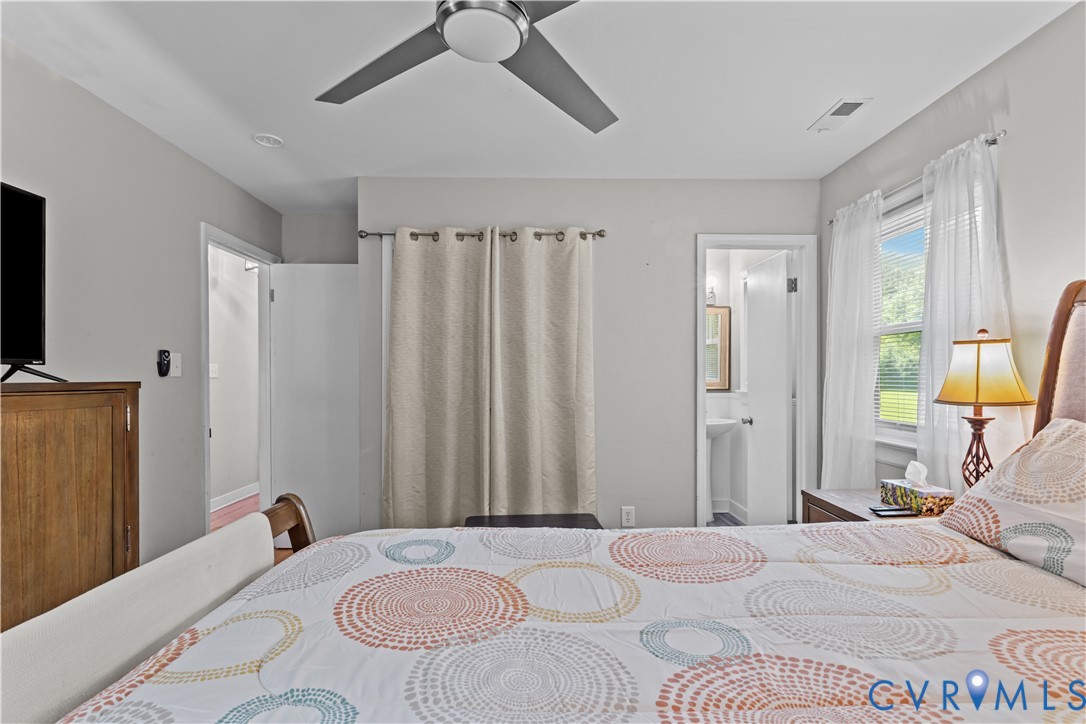 7586 Willson Road Henrico, VA 23231 - Photo 20 of 32 Bedroom featuring connected bathroom and a ceiling