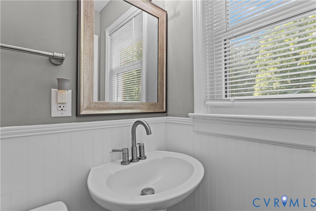 7586 Willson Road Henrico, VA 23231 - Photo 22 of 32 Bathroom with a wainscoted wall and a sink