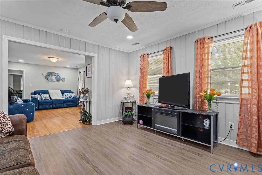 7586 Willson Road Henrico, VA 23231 - Photo 24 of 32 Living area with wood finished floors, wood walls,