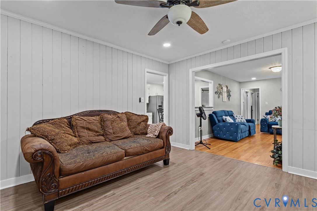 7586 Willson Road Henrico, VA 23231 - Photo 26 of 32 Living area with wood finished floors, wood walls,