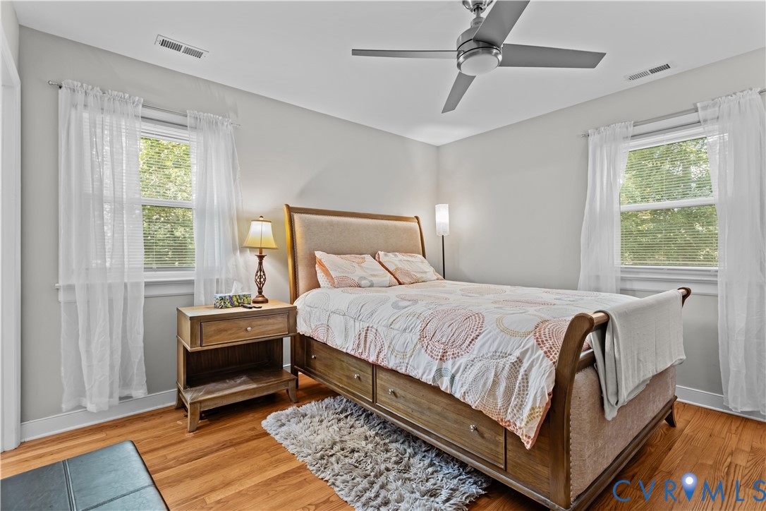 7586 Willson Road Henrico, VA 23231 - Photo 6 of 32 Bedroom with wood finished floors, multiple window
