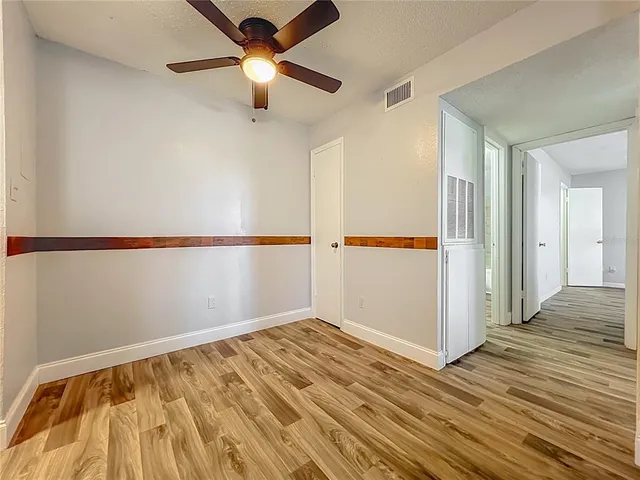 a view of a kitchen with a sink and a fireplace