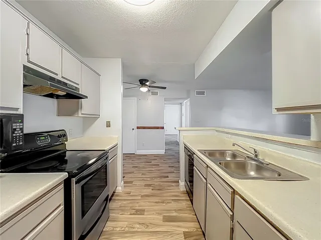 a kitchen with a stove and a microwave