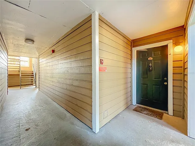 a view of front door and bedroom