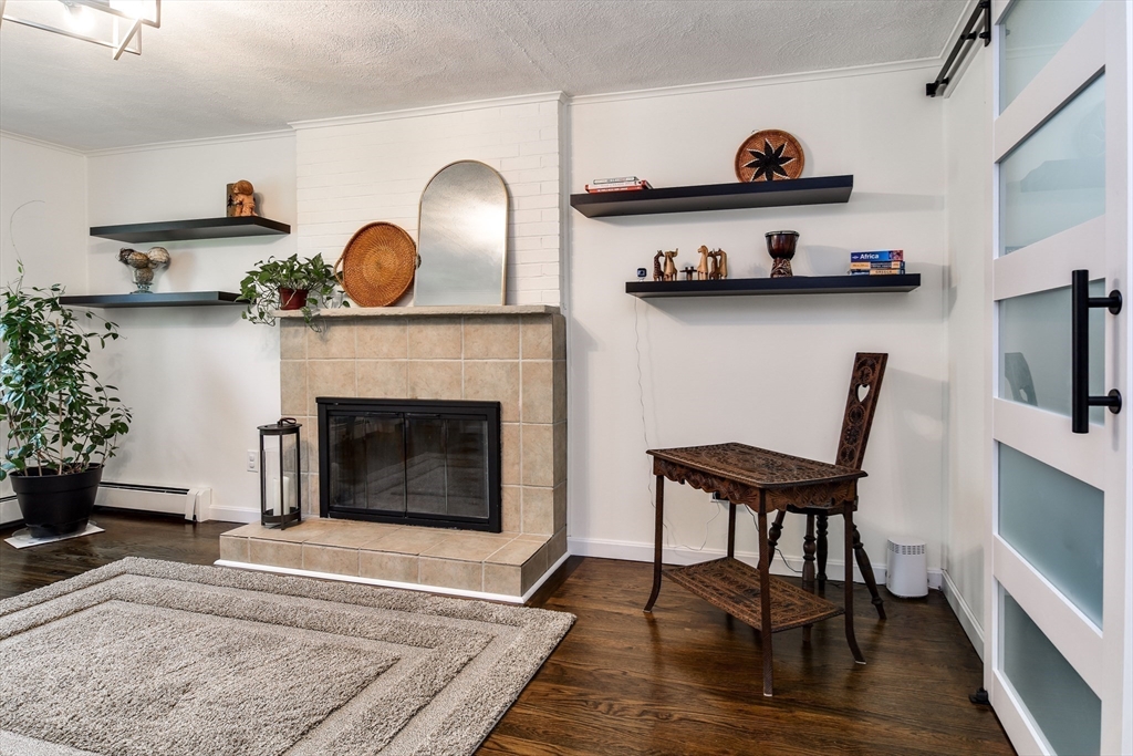 1 Woodside Road Framingham, MA 01701 - Photo 14 of 41 a living room with furniture and a fireplace