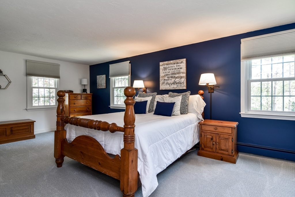 1 Woodside Road Framingham, MA 01701 - Photo 20 of 41 a bedroom with a bed and wooden floor
