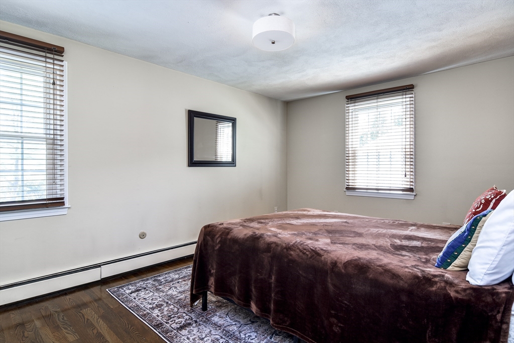 1 Woodside Road Framingham, MA 01701 - Photo 26 of 41 a bed sitting in a bedroom next to a window
