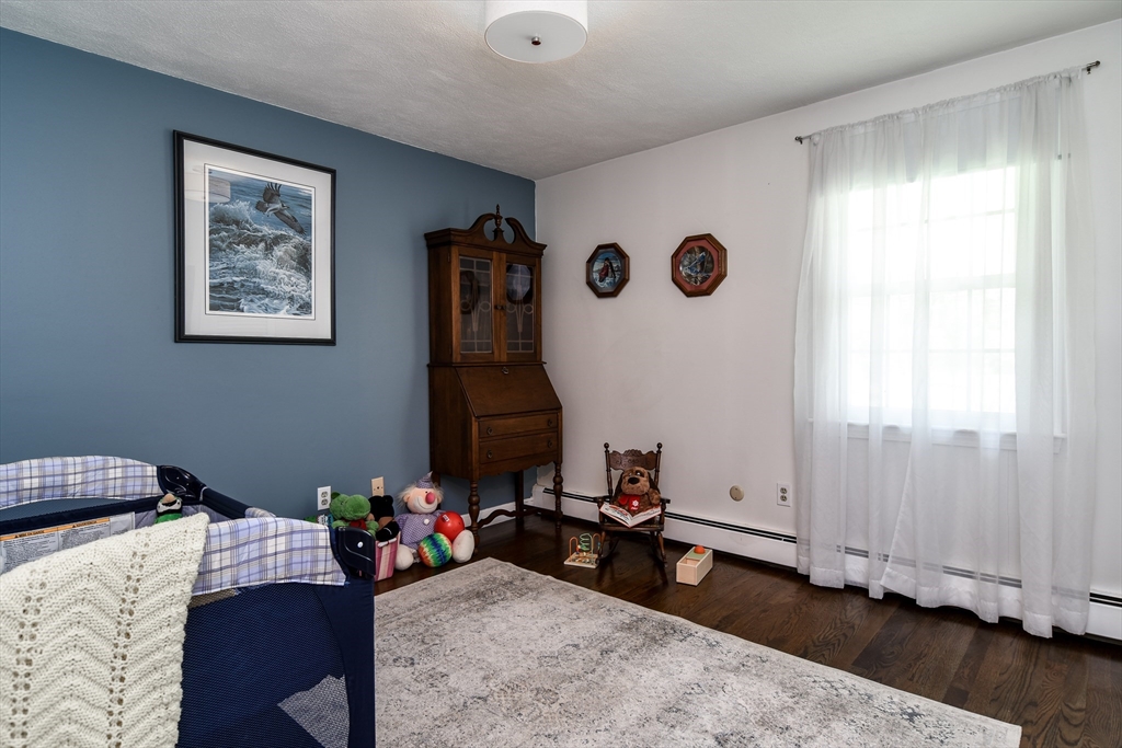 1 Woodside Road Framingham, MA 01701 - Photo 28 of 41 a bedroom with bed and a window