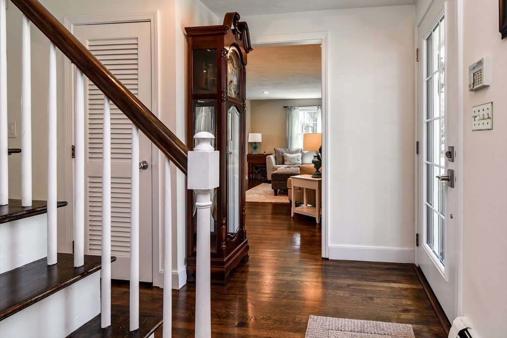 1 Woodside Road Framingham, MA 01701 - Photo 3 of 41 a view of a hallway with wooden floor and staircase