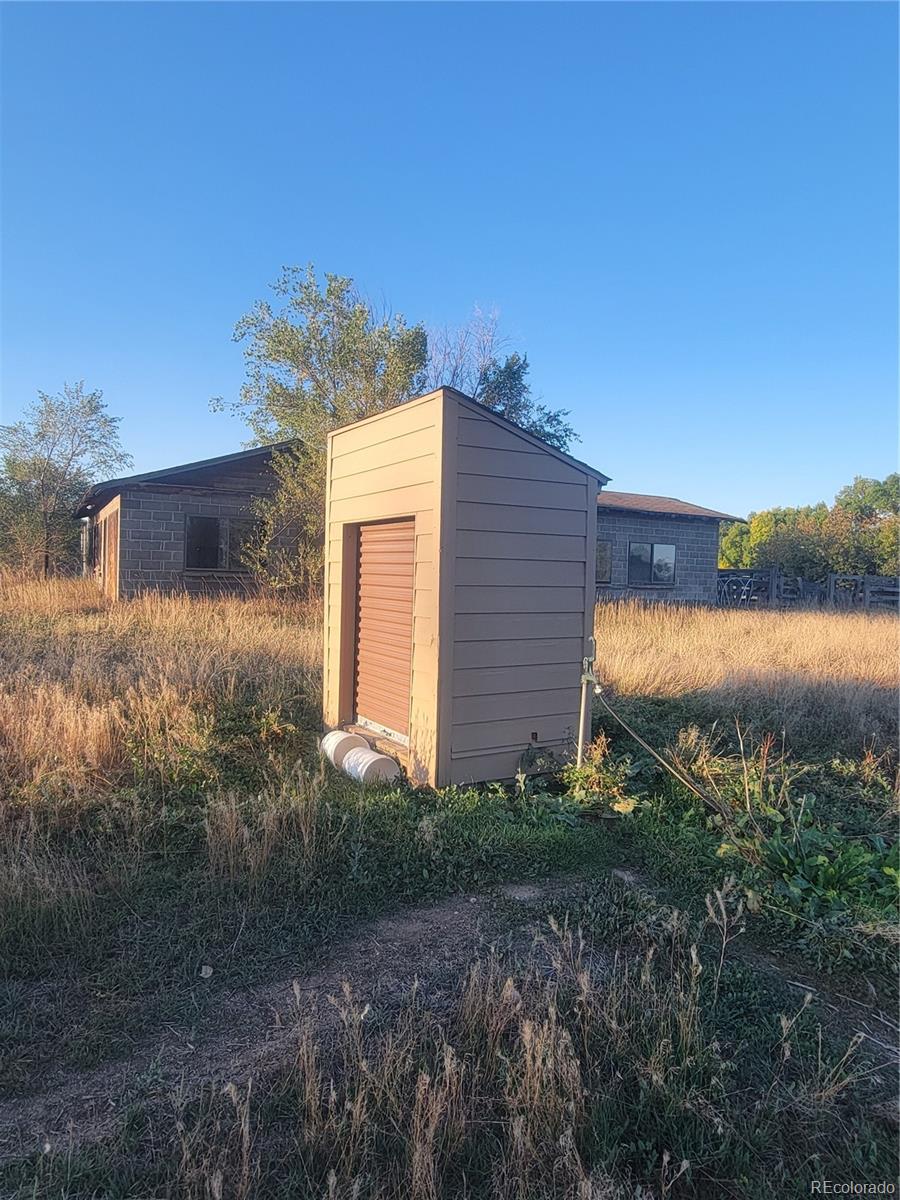 Main Street Timnath, CO 80525 - Photo 7 of 7 a view of a house with a yard