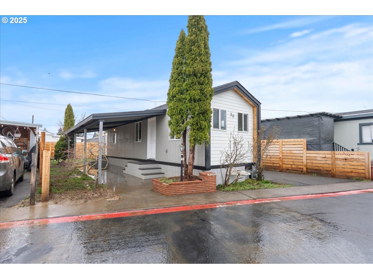 8951 Southeast Fuller Road, Unit 36 Happy Valley, OR 97086 - Photo 1 of 27 a backyard of a house