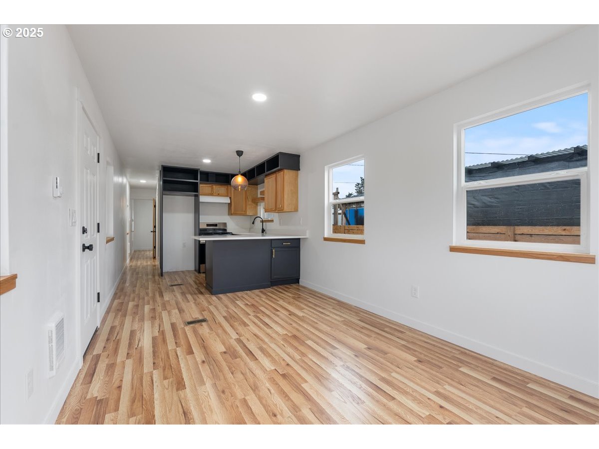8951 Southeast Fuller Road, Unit 36 Happy Valley, OR 97086 - Photo 11 of 27 a view of kitchen with wooden floor