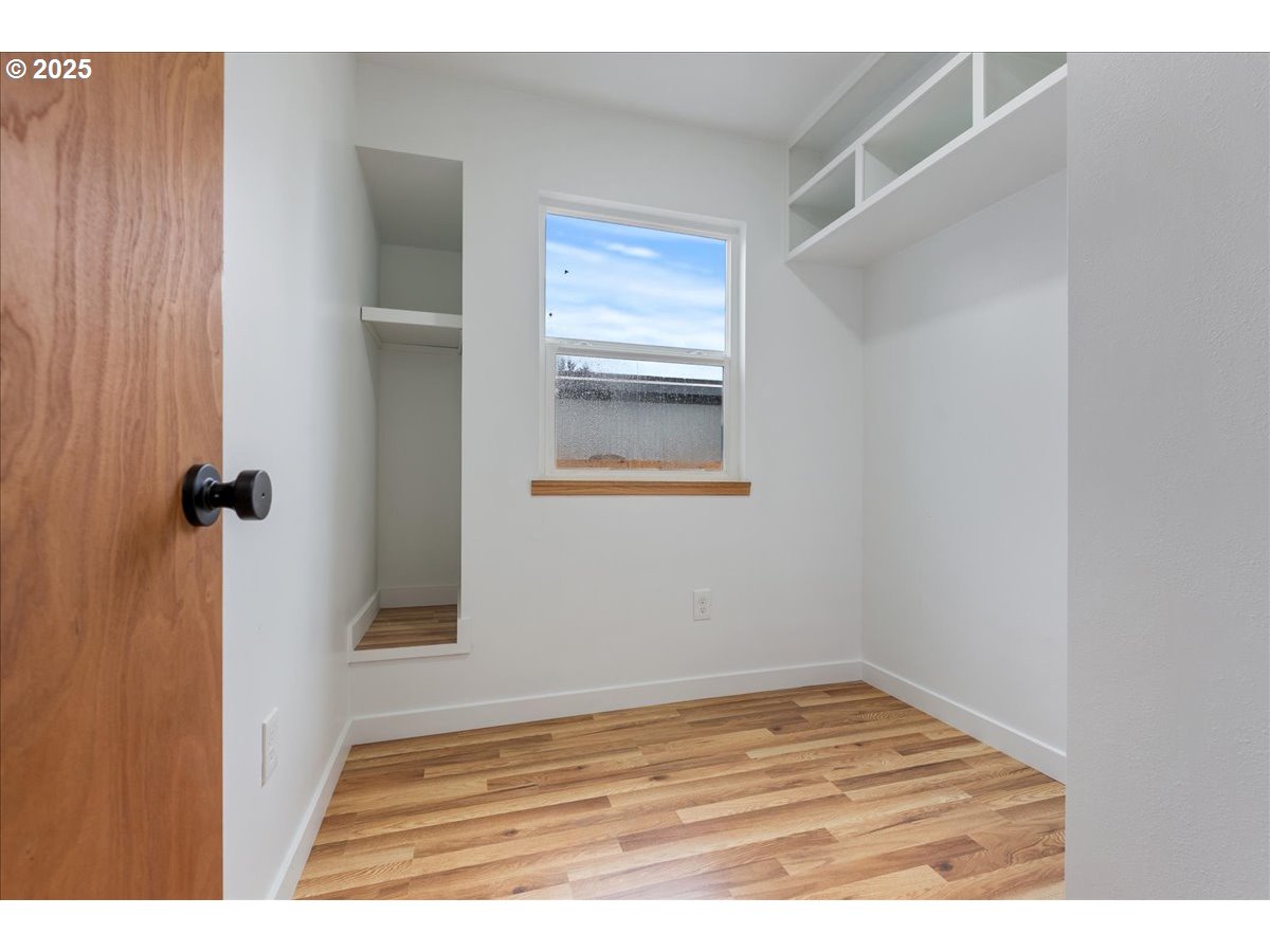 8951 Southeast Fuller Road, Unit 36 Happy Valley, OR 97086 - Photo 12 of 27 a view of a room that has a window in it