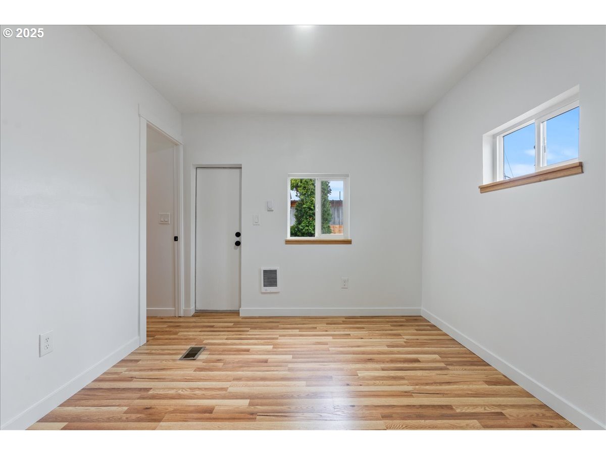 8951 Southeast Fuller Road, Unit 36 Happy Valley, OR 97086 - Photo 13 of 27 a view of empty room with wooden floor