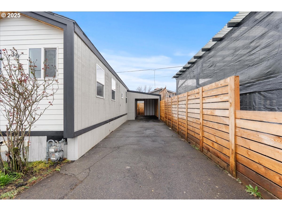 8951 Southeast Fuller Road, Unit 36 Happy Valley, OR 97086 - Photo 20 of 27 a view of a house with a yard