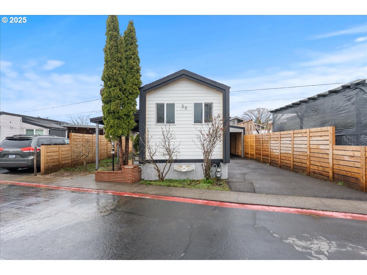 8951 Southeast Fuller Road, Unit 36 Happy Valley, OR 97086 - Photo 2 of 27 a view of outdoor space and parking