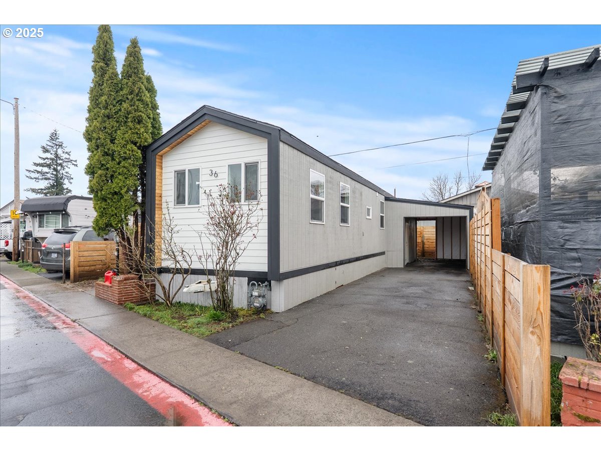 8951 Southeast Fuller Road, Unit 36 Happy Valley, OR 97086 - Photo 21 of 27 a view of a house with a patio