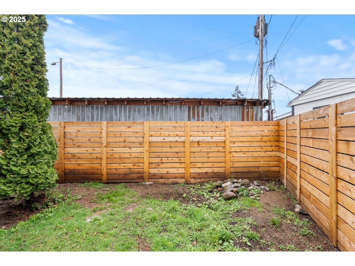 8951 Southeast Fuller Road, Unit 36 Happy Valley, OR 97086 - Photo 22 of 27 a view of a pathway with a building in the background