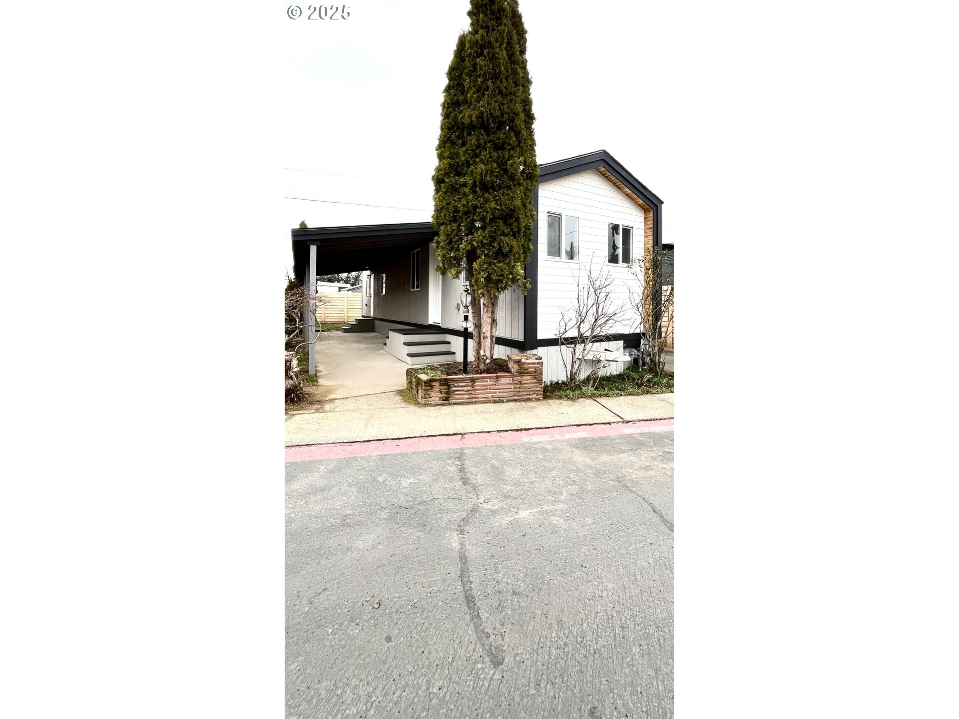 8951 Southeast Fuller Road, Unit 36 Happy Valley, OR 97086 - Photo 3 of 27 a view of residential house with swimming pool and sitting area