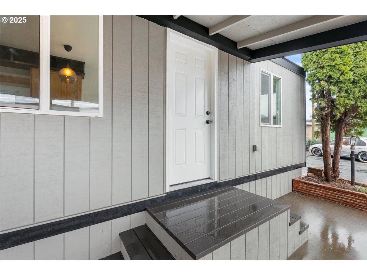 8951 Southeast Fuller Road, Unit 36 Happy Valley, OR 97086 - Photo 5 of 27 a view of an entryway with wooden floor