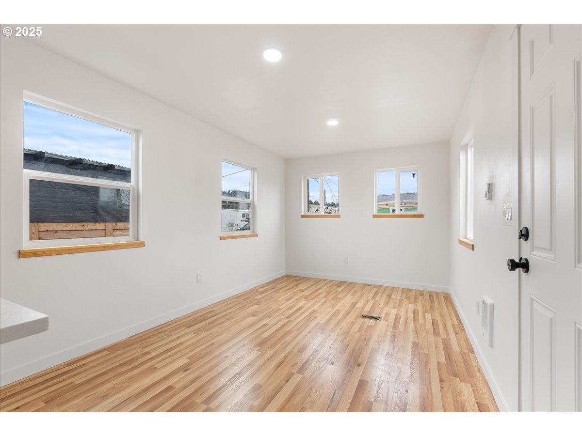 8951 Southeast Fuller Road, Unit 36 Happy Valley, OR 97086 - Photo 7 of 27 a view of an empty room with a window