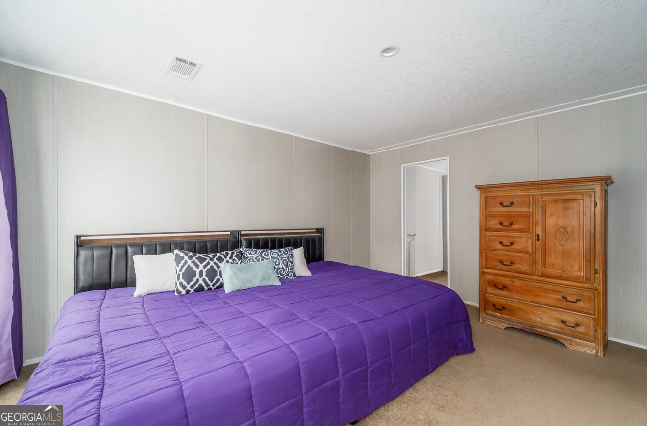 6911 Old Hortense Road Hortense, GA 31543 - Photo 12 of 19 a bedroom with a bed and closet