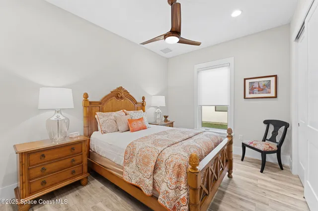 a spacious bathroom with a double vanity sink a mirror and a shower