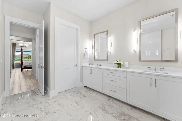 a view of a room with wooden floor table and chairs